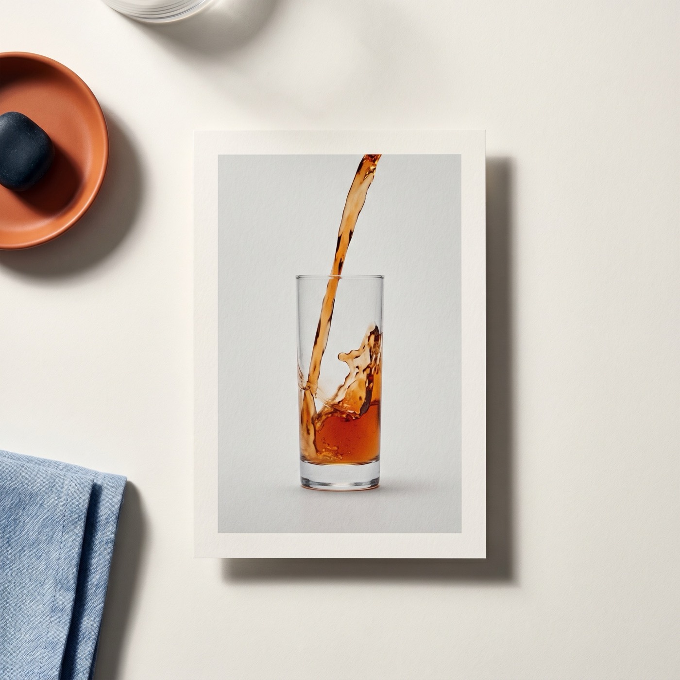 Overhead of a product shot frame showing controlled motion blur on a liquid pour.