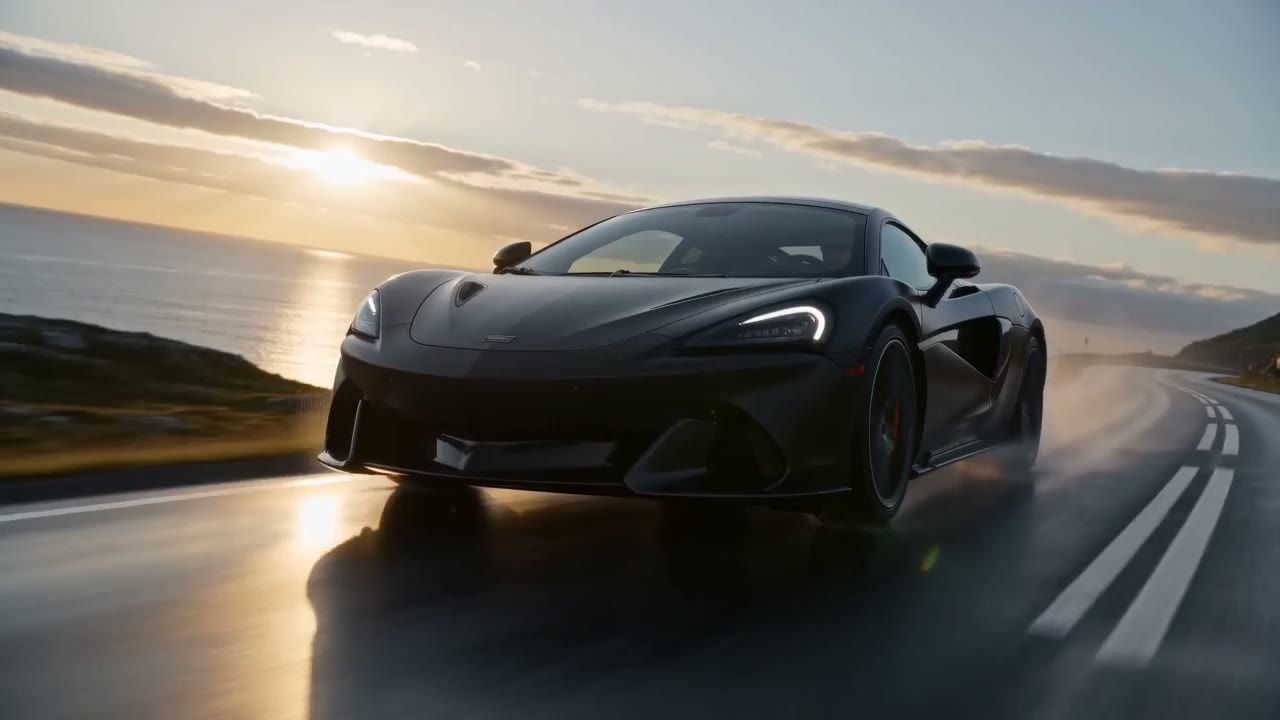 Cinematic AI automotive ad. EV driving on Nordic coastal road at golden hour